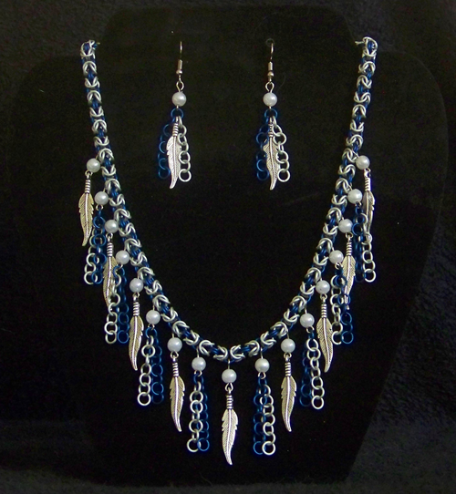 blue and white byzantine chain necklace with silver feathers, pearls and blue and white chains hanging